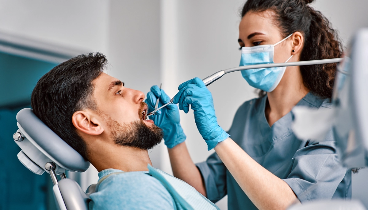 man-getting-a-dental-exam-1200x683.webp