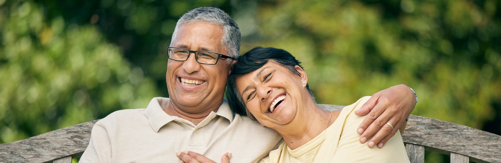 older-couple-laughing-outside-1600x522.webp