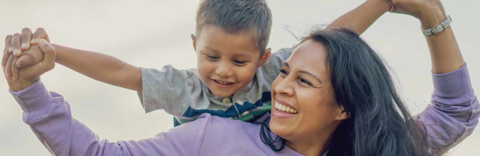 mother-and-son-playing-outside-1600x522.webp