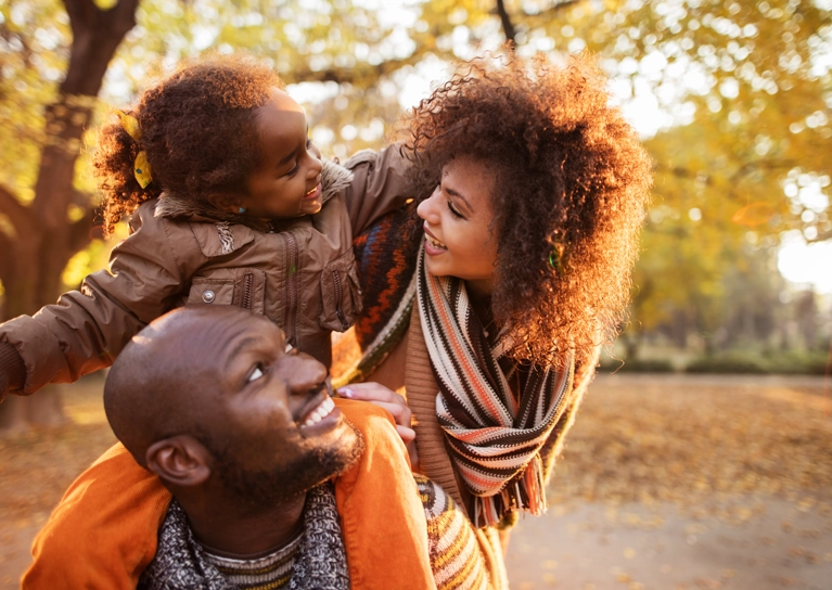 family-playing-outside-in-the-fall-767x544.webp