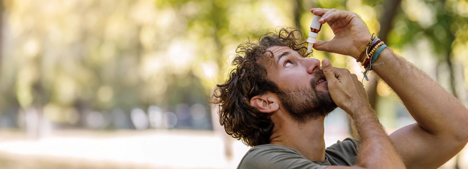 man-putting-eye-drops-in-outside-1600x578-2.webp